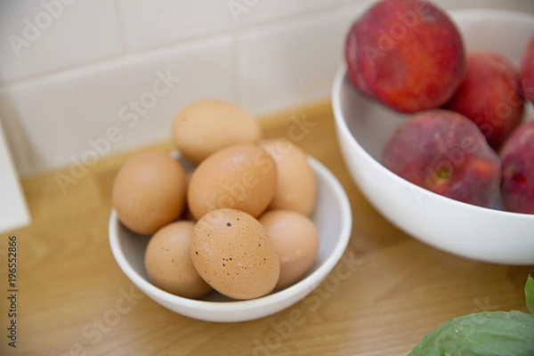 Fototapeta A bowl of organic eggs on a counter