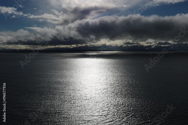 Obraz Sun setting over the ocean