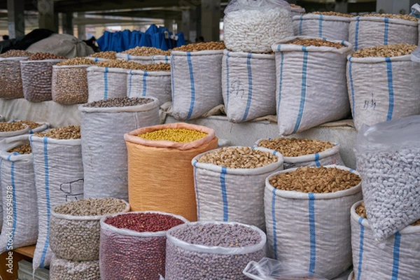 Obraz Raw shelled almonds in bag in orient market
