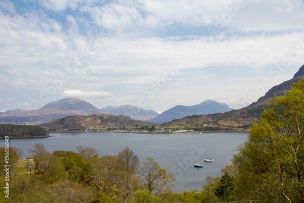 Obraz View of Shieldaig village on the shore of Loch Shieldaig with a background of the Torridon Mountains Beinn Eighe, and Beinn Alligin, in Wester Ross, north west Scotland. On route of North Coast 500.