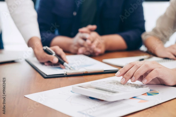 Fototapeta Business team colleagues meeting to conference professional investor working a new marketing business strategy project discussion and analysis data chart and graph, finance and accounting concept