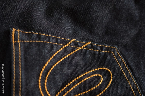 Fototapeta Closeup of Denim texture of denim Jeans and stitch for vintage