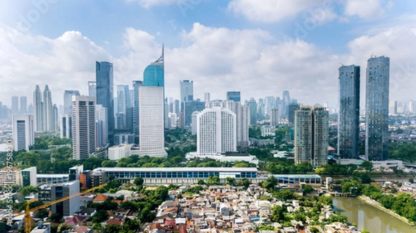 Fototapeta Panoramic view of Jakarta cityscape with residential houses, modern office and apartment buildings