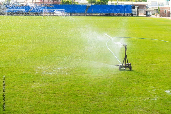Obraz Sprinkler watering the grass