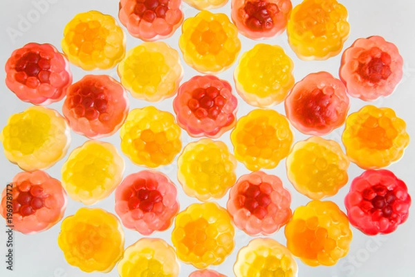 Fototapeta Mosaic of colorful fruit chewing marmalade.