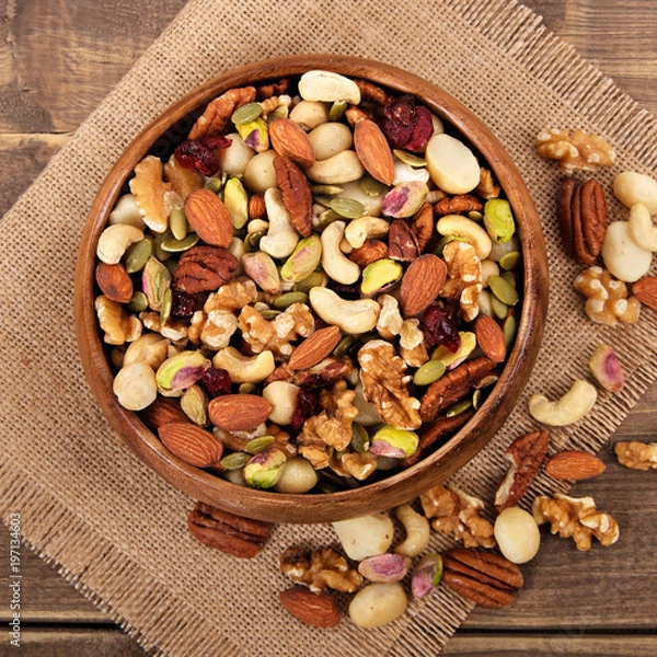Obraz Mixed nuts in wooden bowl with square format