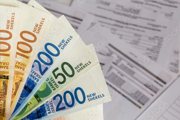 Fototapeta Israeli New Shekel banknotes on the Bills background.Concept of Business,banking and pension planning