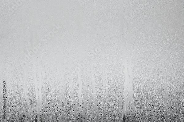 Obraz Blue background of natural water condensation, window glass with high air strong humidity, large drops drip. Collecting and streaming down