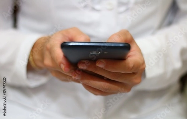 Fototapeta women holding smartphone in close up
