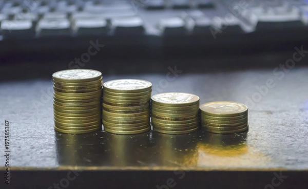 Obraz gold coin set isolate on keyboard background