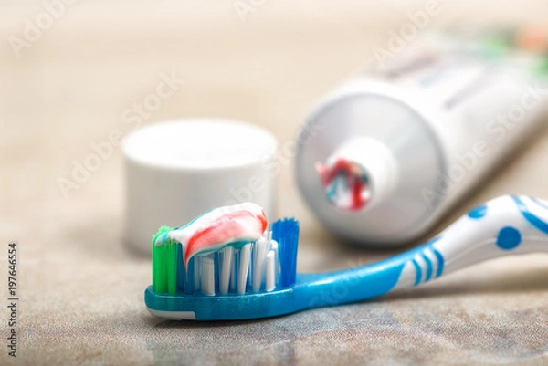 Obraz toothbrush and toothpaste on the shelf