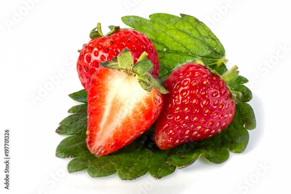Fototapeta strawberry with sliced half and leaves isolated on white background