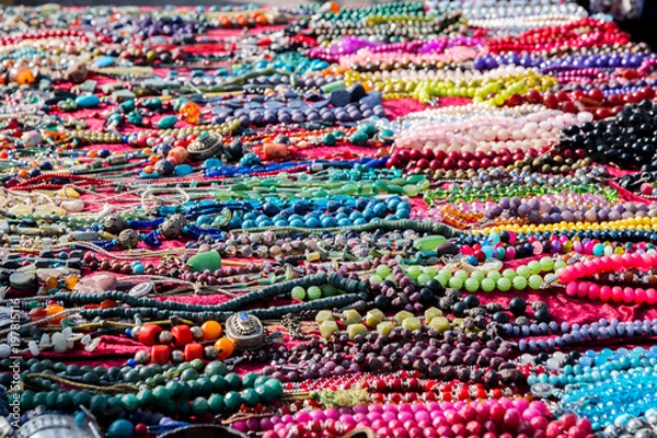 Fototapeta Colorful necklaces for sale at the flea market, consumption background, selected focus, narrow depth of field