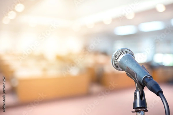 Fototapeta Microphone in conference on seminar room event background	
