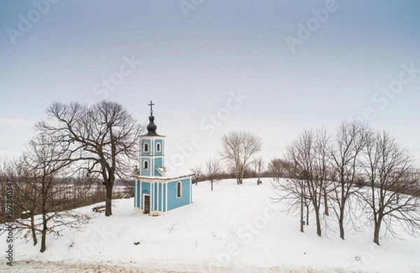 Obraz small blue chapel with snow