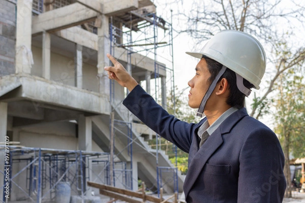 Fototapeta Engineers are inspecting work on site.
