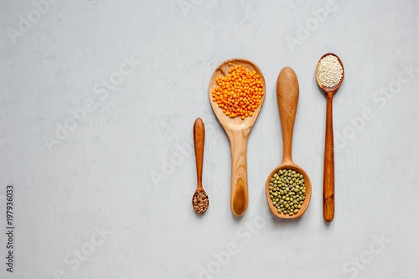 Fototapeta Handmade spoons. Wooden spoons with lentils and other grains.