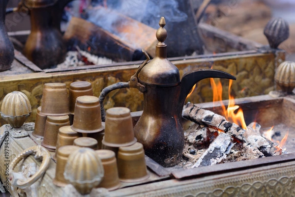 Fototapeta Preparing Oriental coffee in dallah