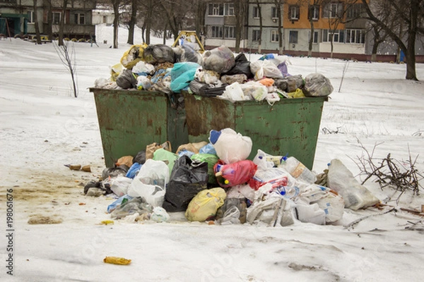 Fototapeta overcrowded garbage cans