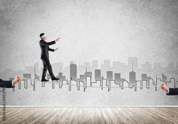 Fototapeta Business concept of risk support and assistance with man balancing on rope