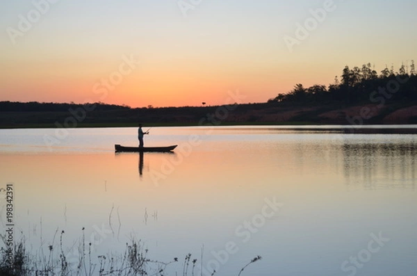 Fototapeta PESCADOR E PÔR DO SOL