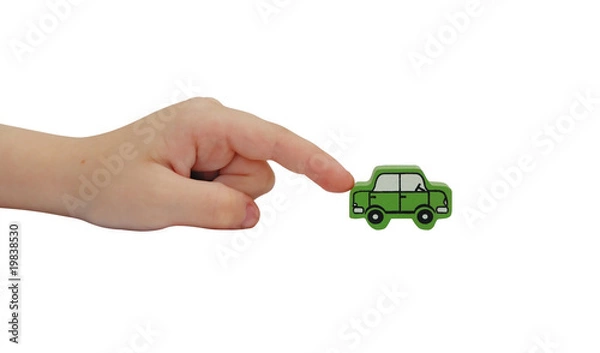 Fototapeta finger pushing on a wooden car isolated on white