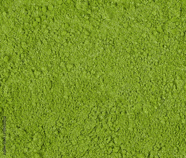 Fototapeta Background of green powder, border surface close up of powdered green tea