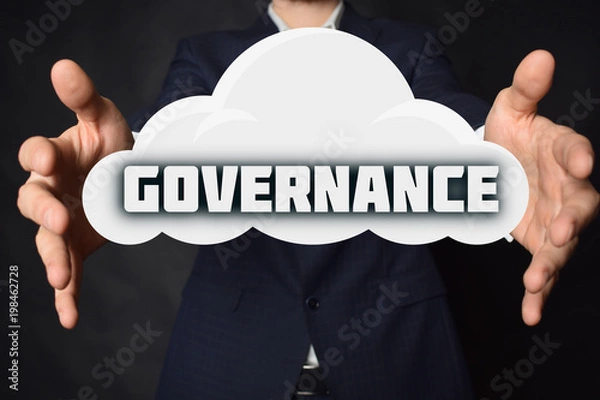 Obraz In the hands of a businessman, a cloud with the inscription:GOVERNANCE