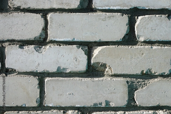 Fototapeta Wall of white brick. Brick masonry with smooth seams. Accurate brickwork. Brick masonry with smooth seams. Accurate brickwork. Wall texture background. Building of white brick.