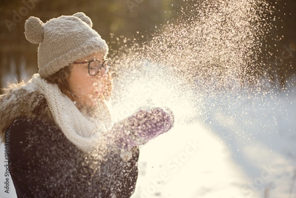 Obraz Young adult playing with snow