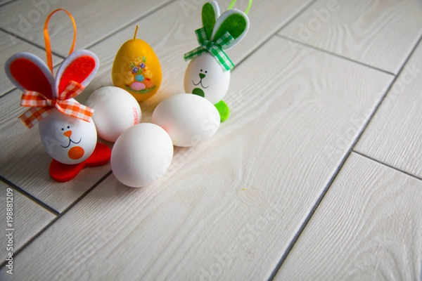 Obraz Easter eggs on wooden background. Happy Easter. Creative photo with easter eggs