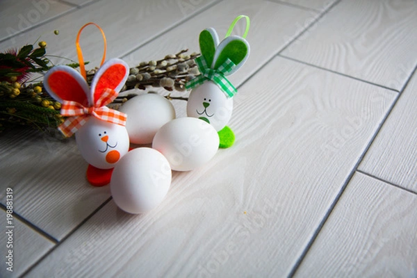 Fototapeta Easter eggs on wooden background. Happy Easter. Creative photo with easter eggs