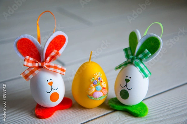 Fototapeta Easter eggs on wooden background. Happy Easter. Creative photo with easter eggs.