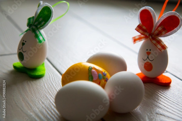 Fototapeta Easter eggs on wooden background. Happy Easter. Creative photo with easter eggs