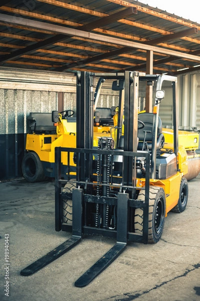 Obraz Background of a lot of forklifts, reliable heavy loader, truck