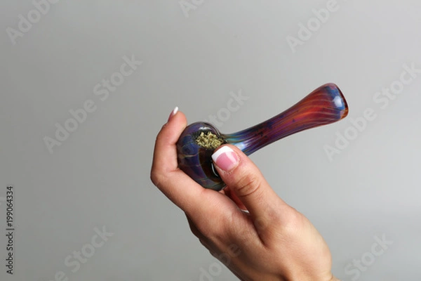 Obraz Marijuana pipe in a hand