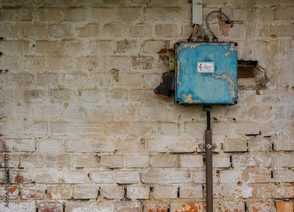 Obraz Old bad rusty switch box on weathered wall
