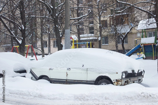 Fototapeta Parked car under snow