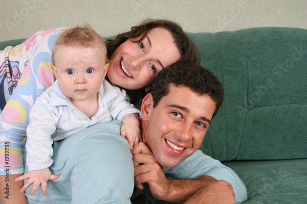 Fototapeta family with baby on sofa 2