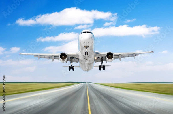 Fototapeta Airplane aircraft flying departure landing speed motion on a runway in the good weather with cumulus clouds sky day.