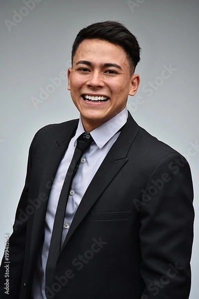 Fototapeta Smiling Latino Business Man Wearing Suit And Tie