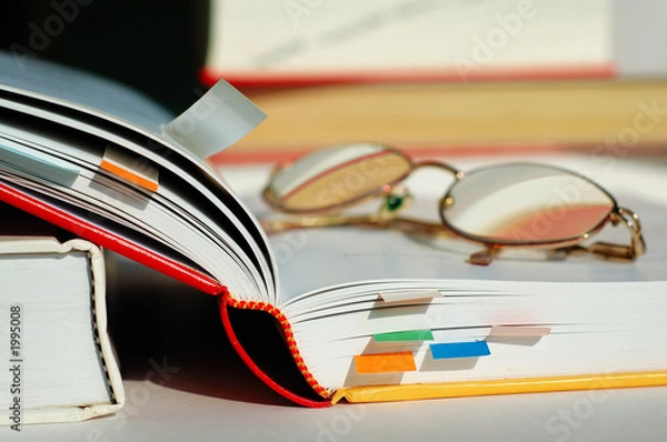 Obraz opened book and glasses