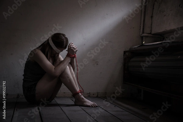 Fototapeta Victims of abducted women get wrists and feet in red..You have no way to fight or resist. She needs help..Hostage concept or female kidnapped from robber..Copy space