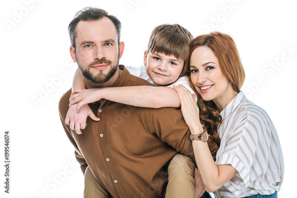 Fototapeta happy parents with adorable little son smiling at camera isolated on white