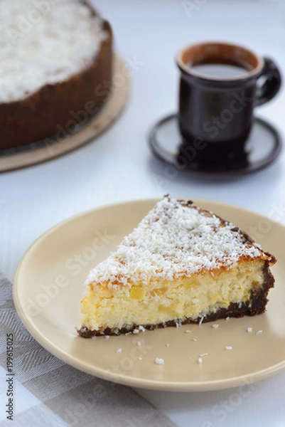 Fototapeta coconut cheesecake with a cup of tea
