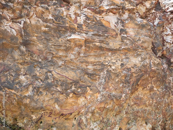 Fototapeta Red textured cliff face