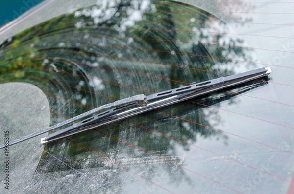 Fototapeta Dirty car window with a wiper blade