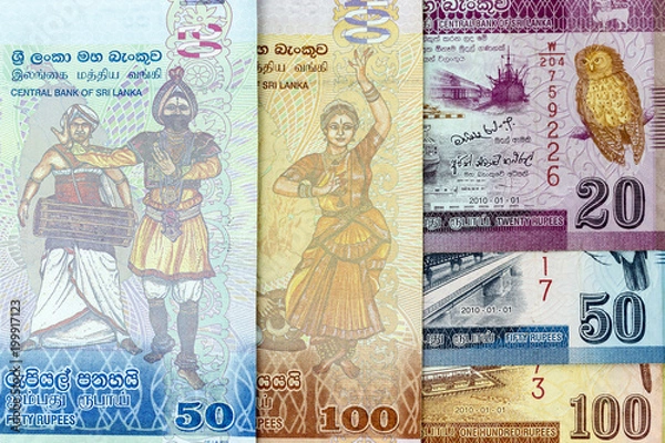 Fototapeta Currency banknotes spread across frame sri lankan rupee in various denomination