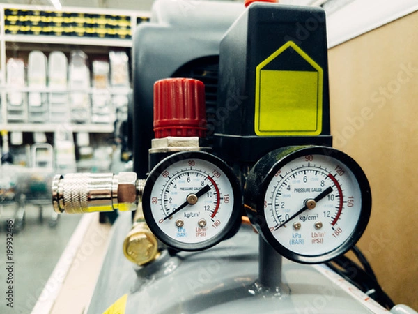 Obraz Air compressor system: manometer, cable, gun and accessories, closeup.