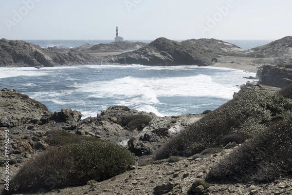 Fototapeta Lighthouse on the slate cape of Favaritx, Menorca, Balearic Islands, Spain
